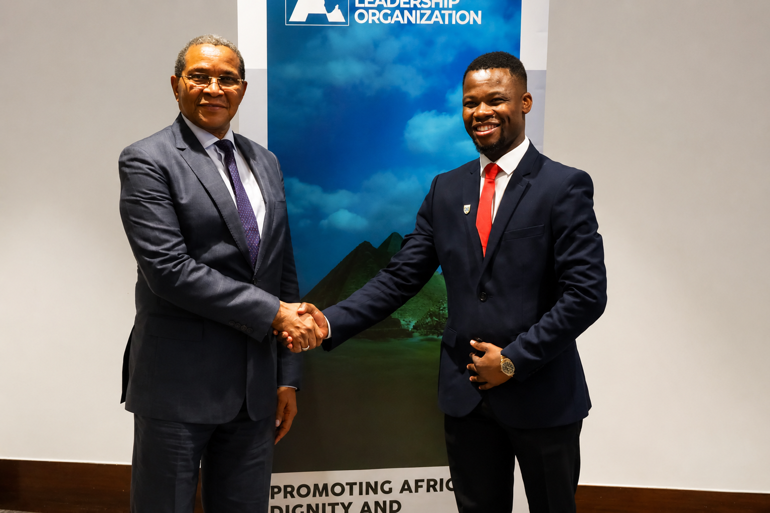 Abel Mavura shaking hands at a leadership organisation event