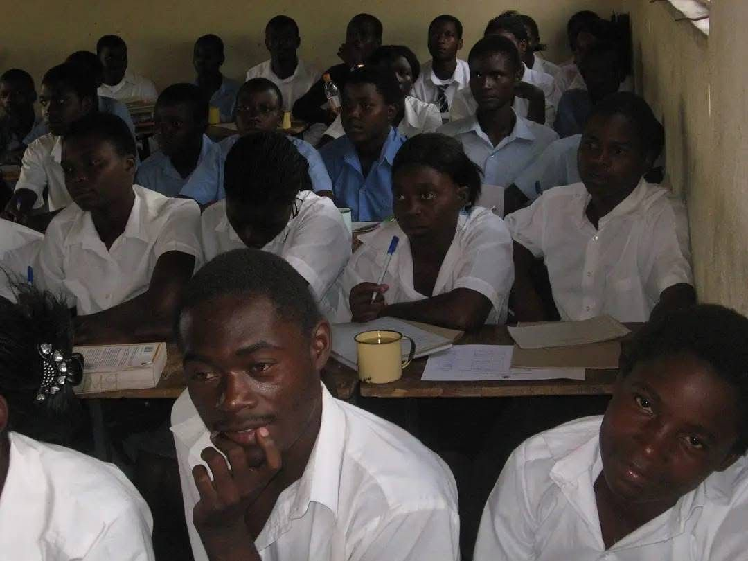 Students seated together in a classroom in Zimbabwe